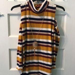 Beautiful blouse with stripes and cute pendant.